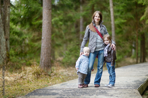 Young mother and her two daughters © MNStudio