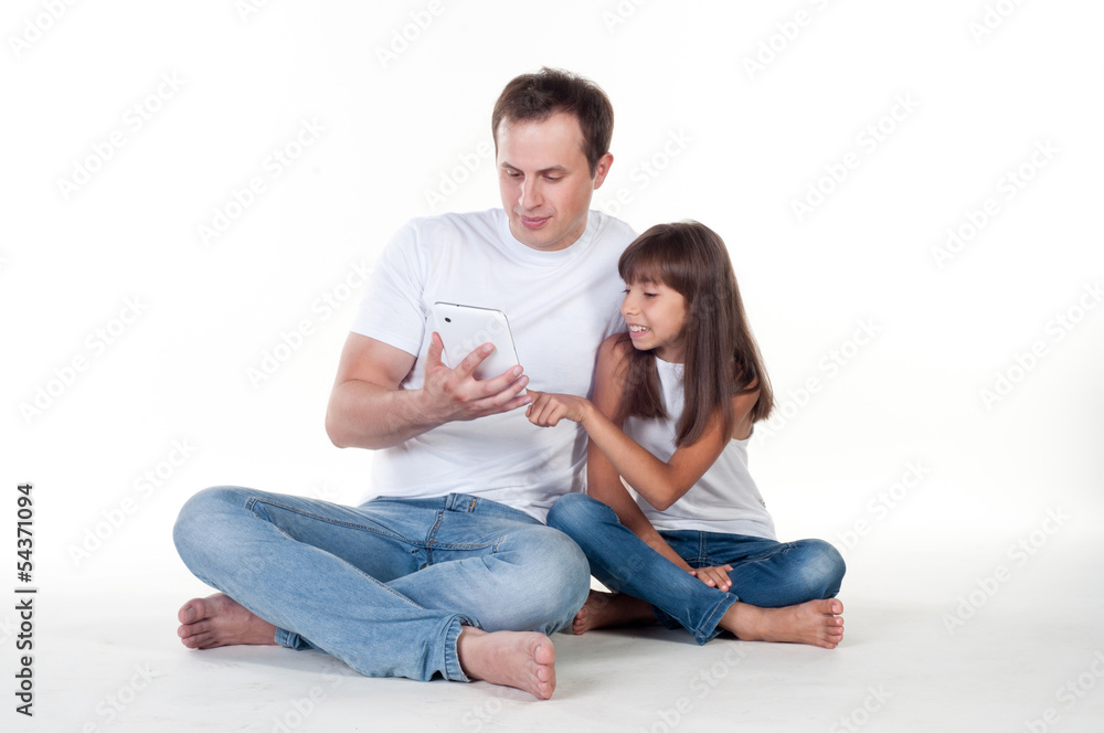 Father with daughter using digital tablet for fun Father with daughter using digital tablet for fun