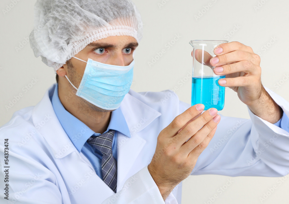 Young laboratory scientist working at lab Young laboratory scientist working at lab