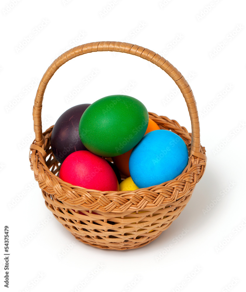 Easter eggs in basket over white Easter eggs in basket over white