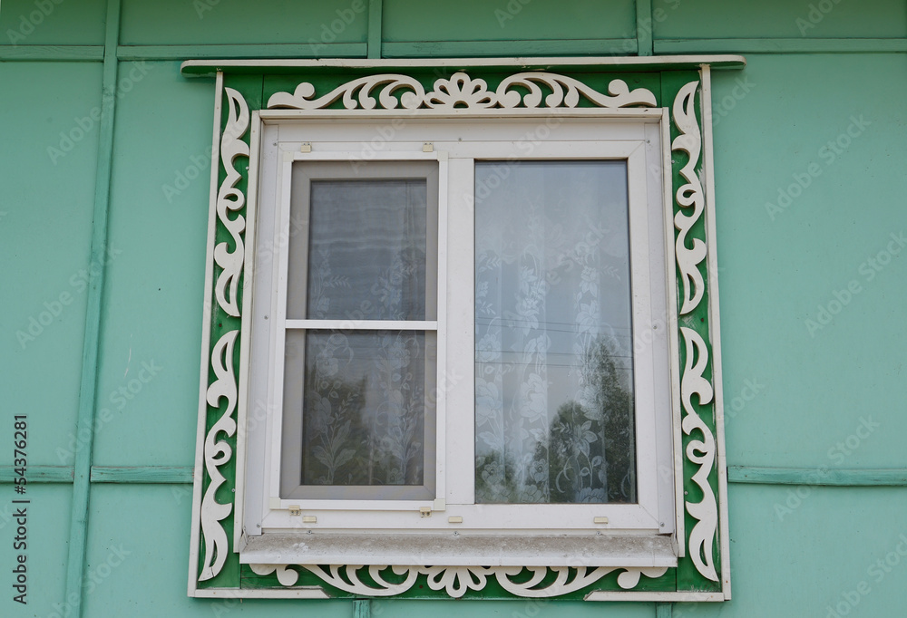 Fototapeta premium Window with carved platbands