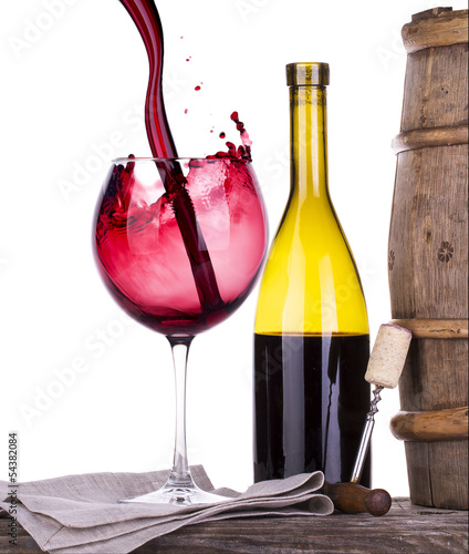 barrel with corkscrew and wine glass photo