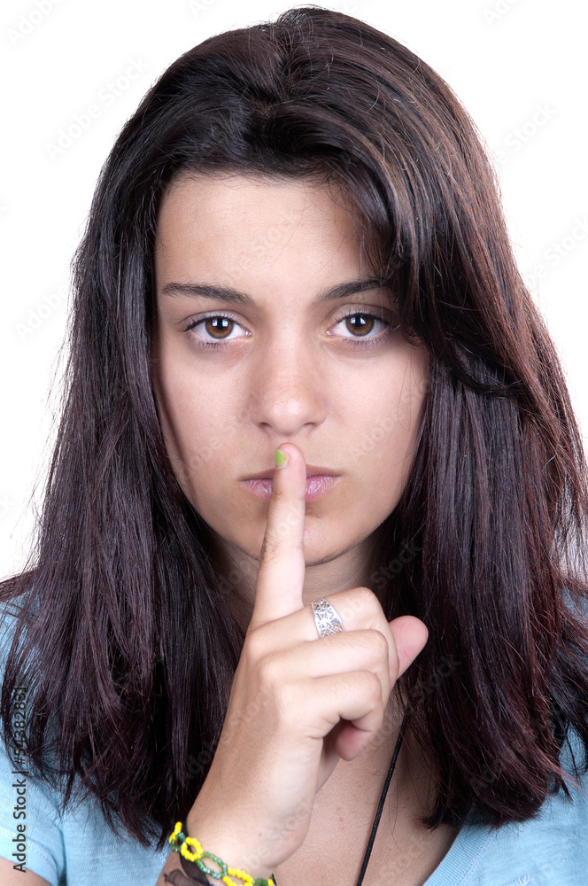 teen girl making a quiet gesture teen girl making a quiet gesture