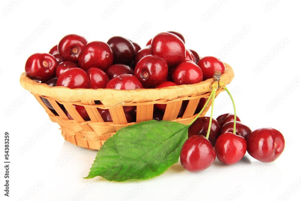 Cherry berries in wicker basket isolated on white Cherry berries in wicker basket isolated on white