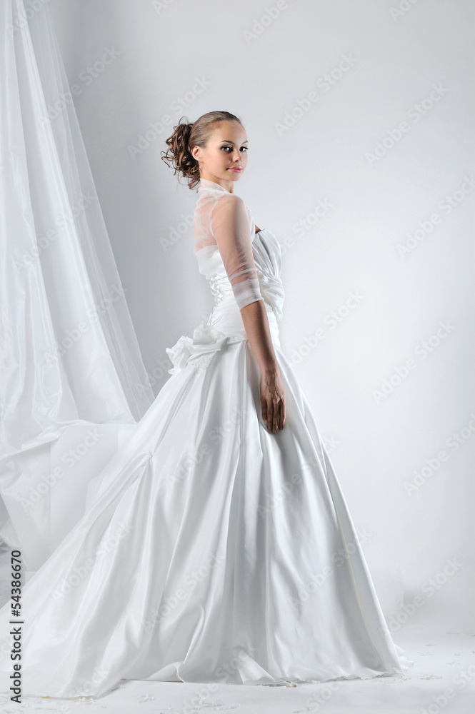 Beautiful bride in a luxurious wedding dress Beautiful bride in a luxurious wedding dress