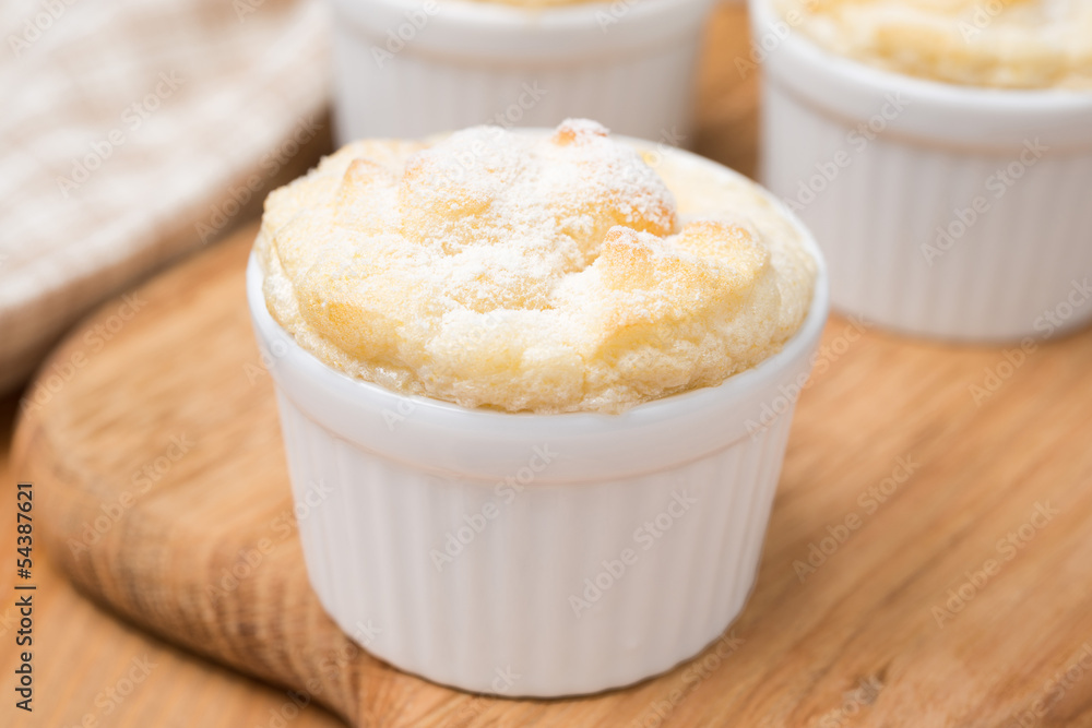 peach souffle in the portioned form on a wooden board, close-up peach souffle in the portioned form on a wooden board, close-up