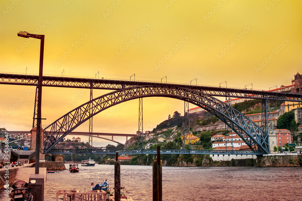 Amazing sunset over Dom Luis Bridge in Porto, Portugal