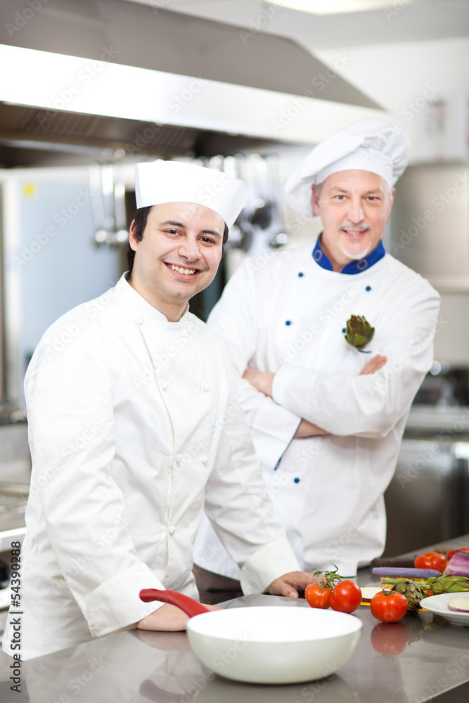 Two chefs working in the restaurant kitchen