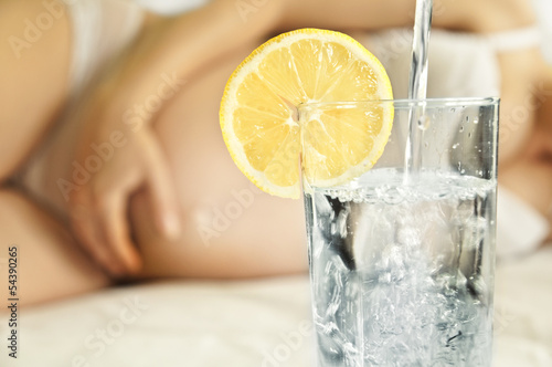 Glass of water for a pregnant woman