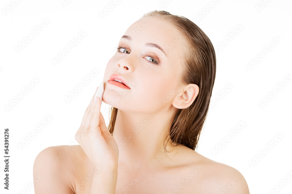 Beautiful woman using cotton pad Beautiful woman using cotton pad