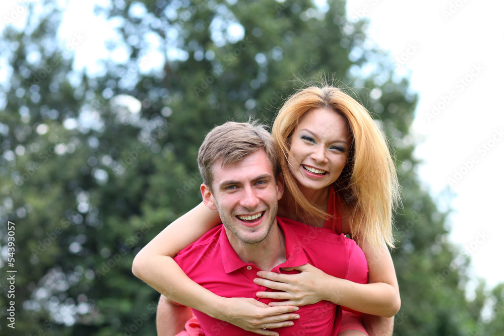 Happy young couple in love at the park Happy young couple in love at the park