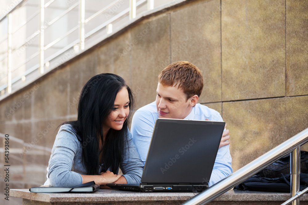 Young business couple using laptop Young business couple using laptop