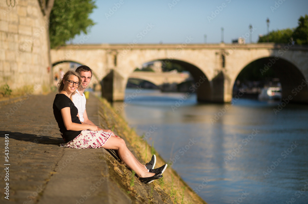 Young couple in Paris near the Seine