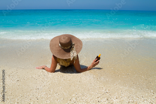 Fototapeta Naklejka Na Ścianę i Meble -  Summer vacation woman on beach