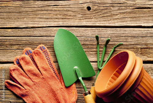 Gardening equipment on rustic wooden boards