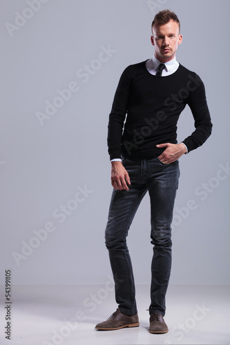 casual man standing with hand in pocket