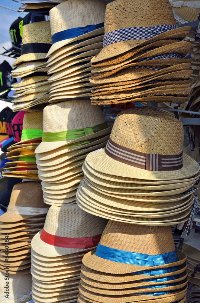 Piles of hats for sale on a shop stall in Oia