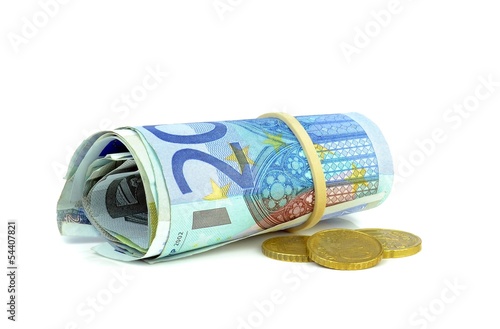 A roll of Euro banknotes and coins on white background