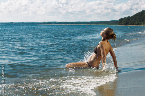 Woman splashing in sea