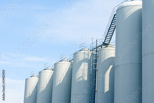 brewery tanks blue sky big containers beer production industry