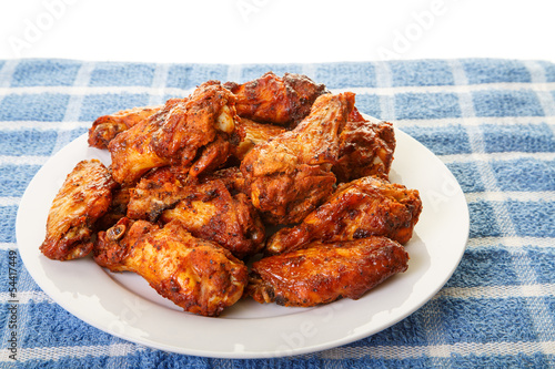 White Plate of Chicken Wings on Blue Mat