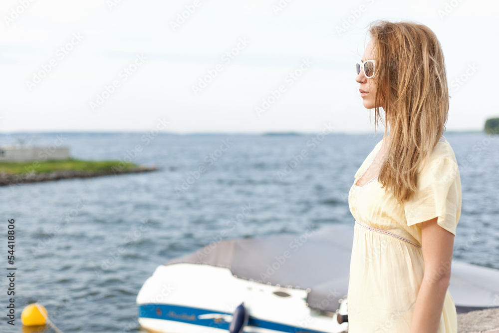 Young woman on sea background