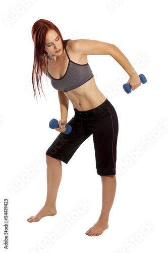 Young woman using hand weights in her workout.