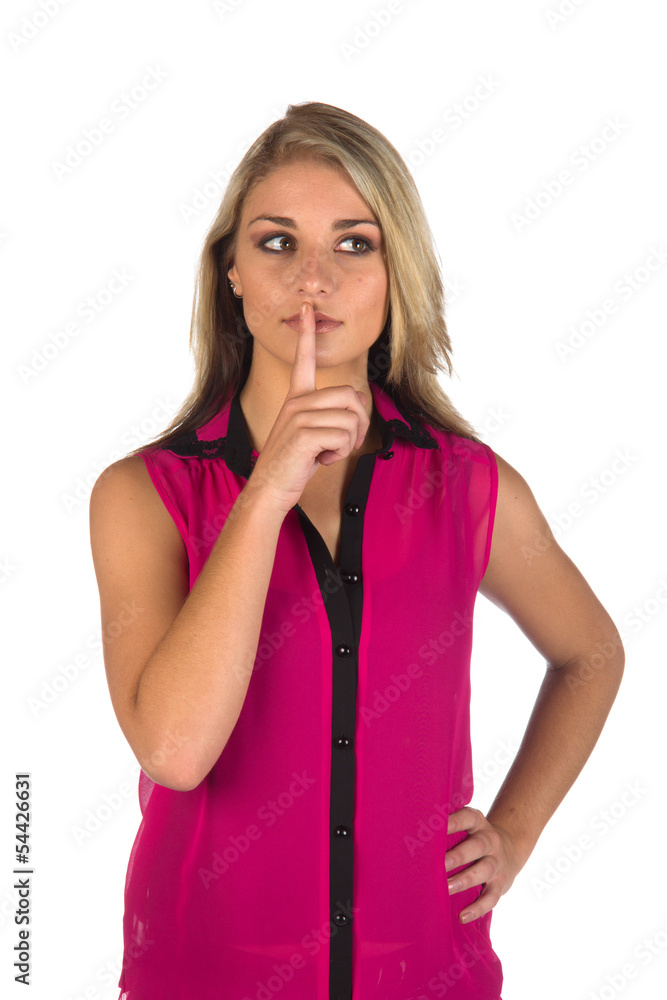 Young woman gesturing to keep quiteworking on a tablet Young woman gesturing to keep quiteworking on a tablet