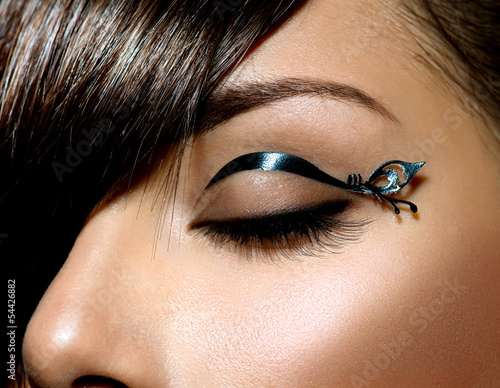 Fashion Make up. Stylish Female Eye With Black Liner makeup photo