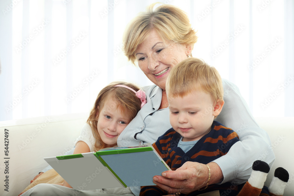 Grandmother reading from a book for grandchilren
