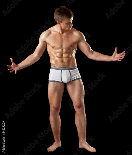 young bodybuilder demonstrates posture © Oleksii Sergieiev