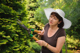 Female gardener in white hat