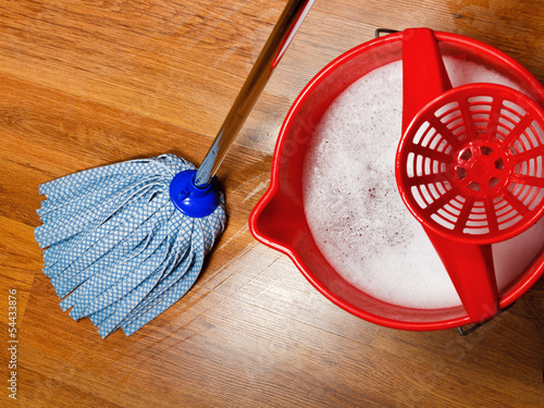 Fototapeta mop and bucket with water for cleaning floors