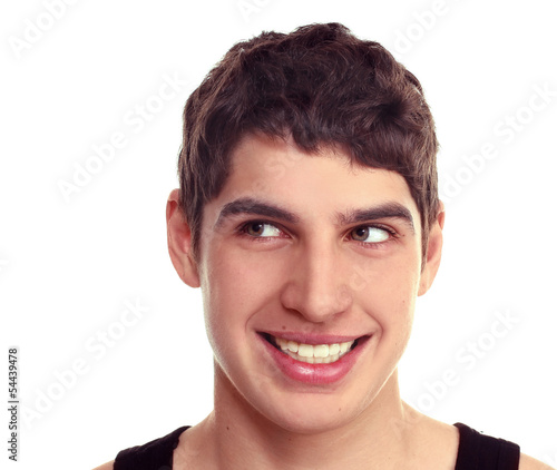 Close-up of a young guy smiling  looking sideways Isolate on whi © lms_lms