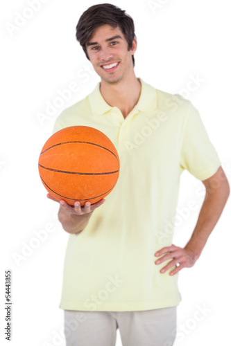 Happy man holding a basket ball