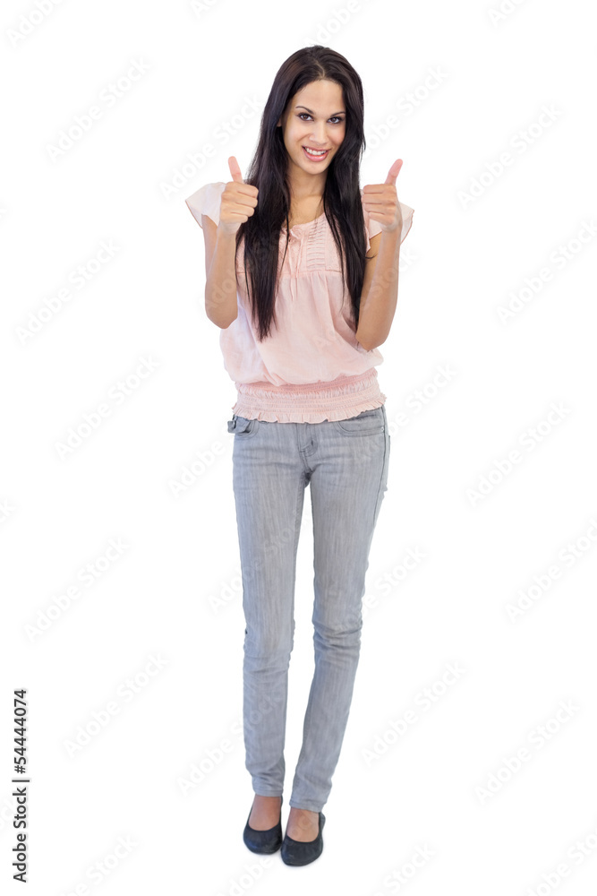 Brunette does thumbs up at camera Brunette does thumbs up at camera
