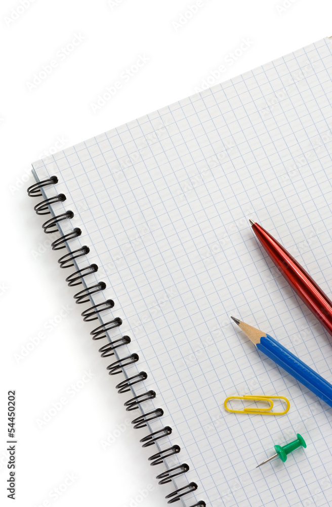 school supplies on checked notebook school supplies on checked notebook