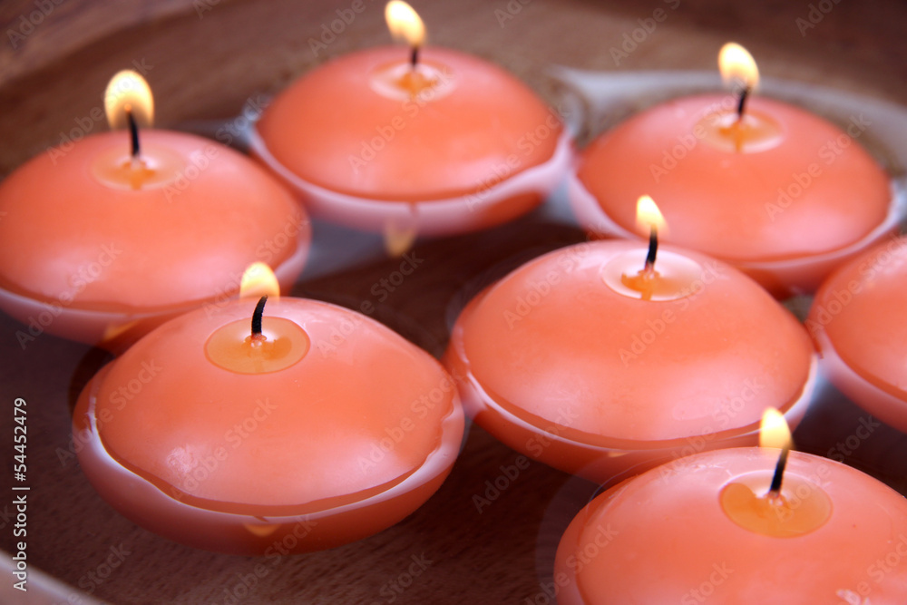 Beautiful candles in water close-up Beautiful candles in water close-up
