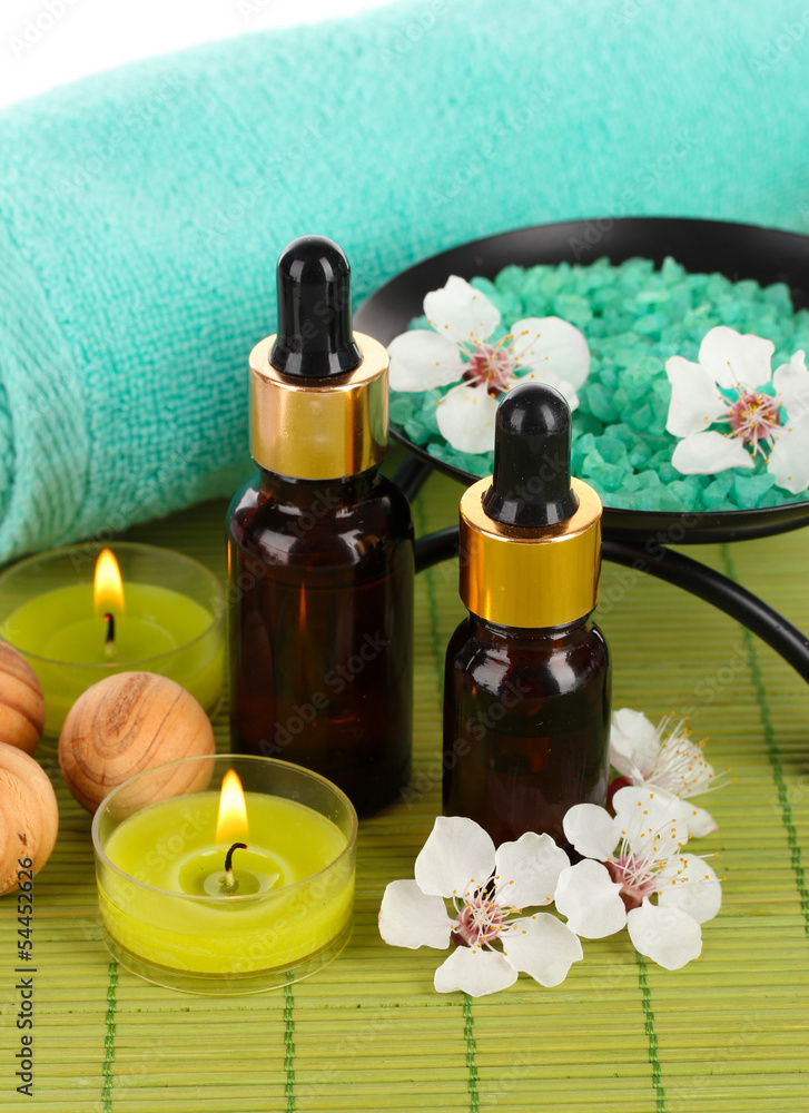 Spa composition with aroma oils on table close-up Spa composition with aroma oils on table close-up