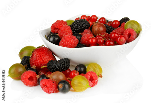 Ripe berries in bowl isolated on white