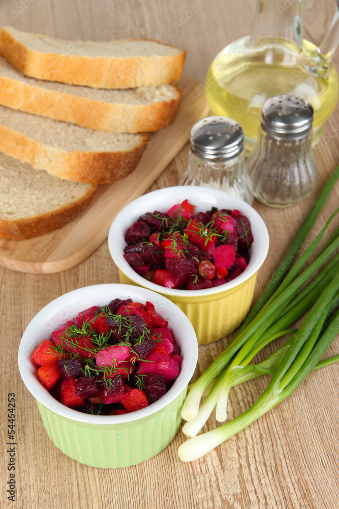 Beet salad in bowls on table close-up Beet salad in bowls on table close-up