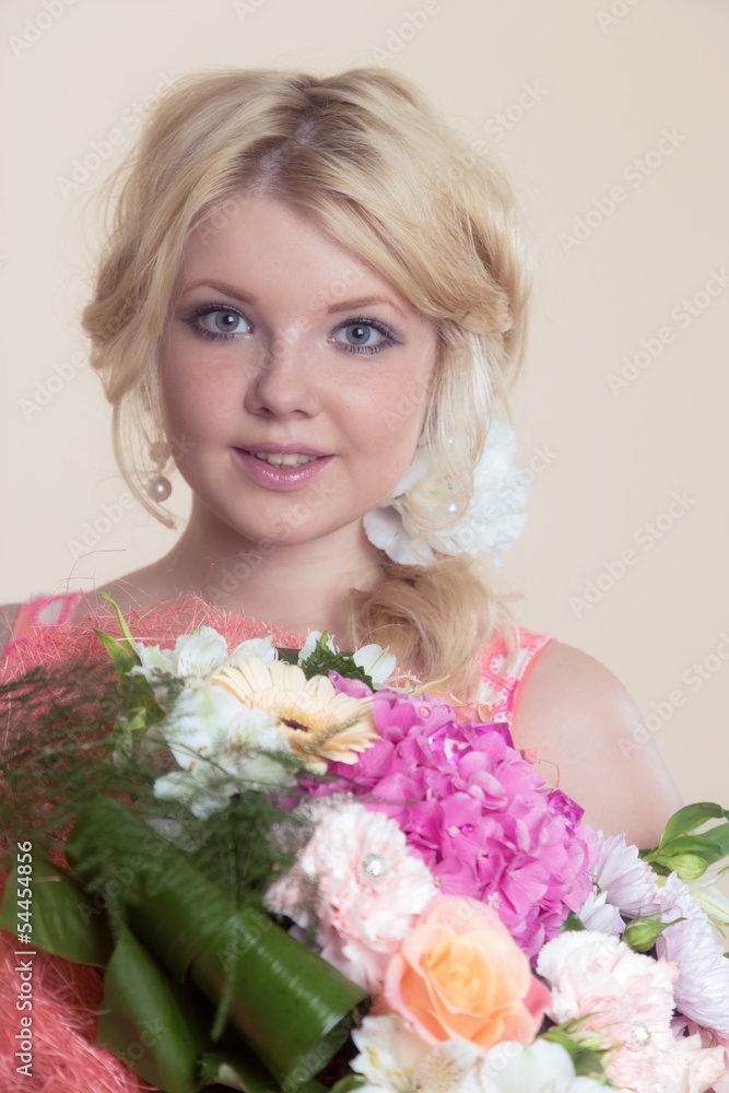 The beautiful girl with a bouquet flowers The beautiful girl with a bouquet flowers
