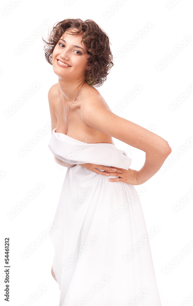 A smiling girl, clothed a white sheet on a white background