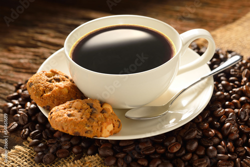 Coffee cup with cookies and fresh coffee beans