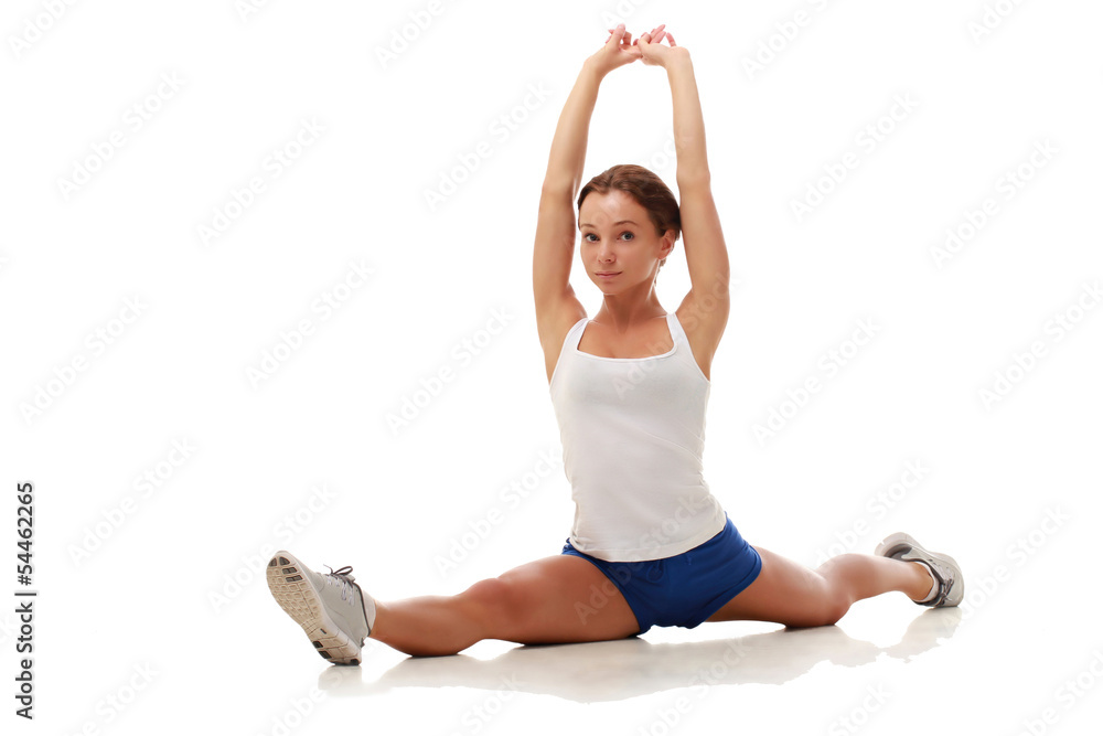 Young pretty fitness model stretching