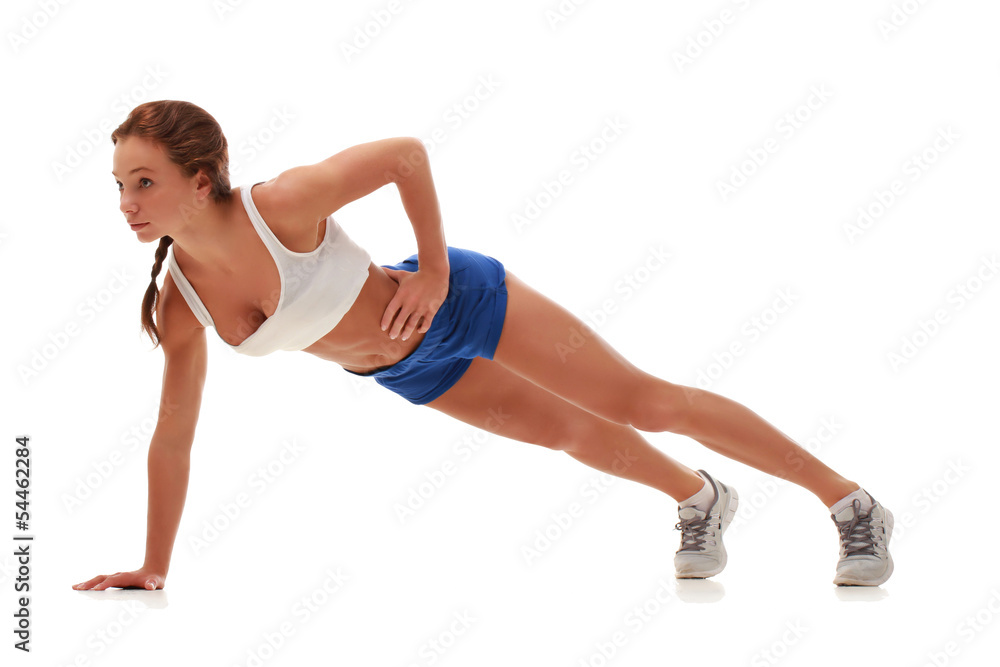 Young pretty fitness model doing pushups Young pretty fitness model doing pushups
