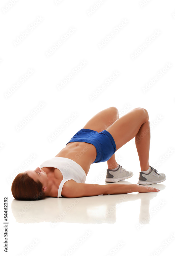 Young pretty fitness model doing abdominal exercises Young pretty fitness model doing abdominal exercises