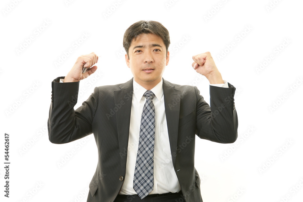 ガッツポーズのビジネスマン