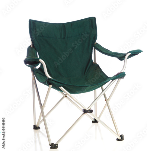 Green folding lawn chair on white