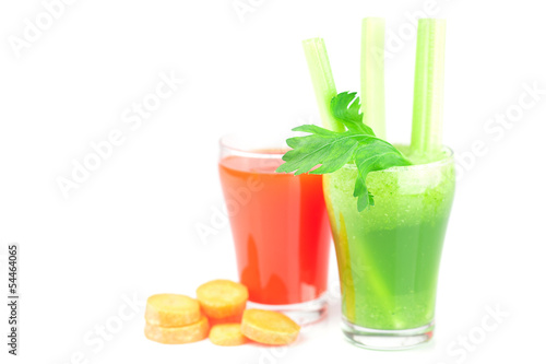 glass of celery juice and a glass of carrot juice isolated on wh